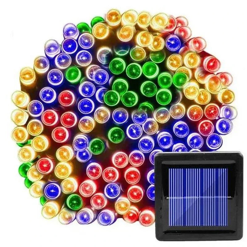 A cluster of colorful LED string lights includes red, blue, green, and yellow bulbs, accompanied by a small rectangular solar panel.