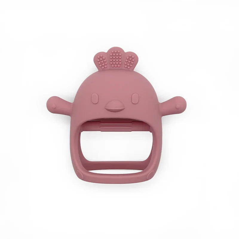 Pink silicone baby teether shaped like a smiling chicken with raised crown pattern, two arms, and a hollow center for easy grip, set against a white background.