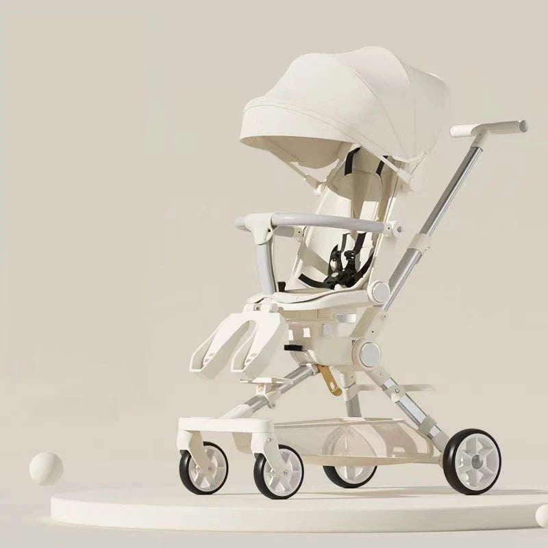 Sleek, modern cream-colored baby stroller with a canopy and four wheels, displayed on a round pedestal against a beige background.