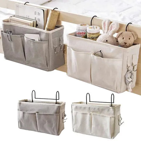 Hanging bedside organizers in grey and beige, with pockets holding books, stuffed animals, and small items. Two display items hang over bed rails, showcasing practical storage solutions.