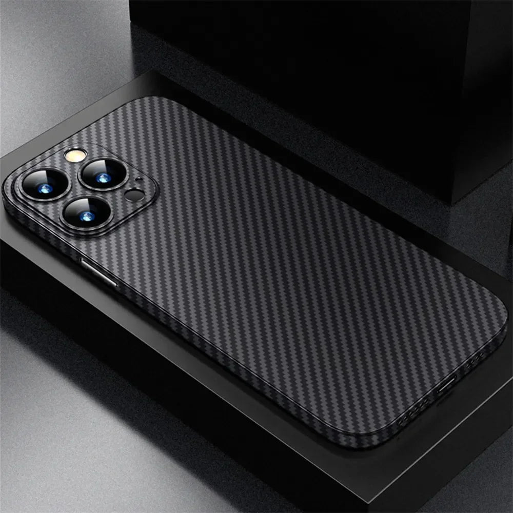 Sleek smartphone with a carbon fiber textured back and triple-camera setup, resting on a dark reflective surface.