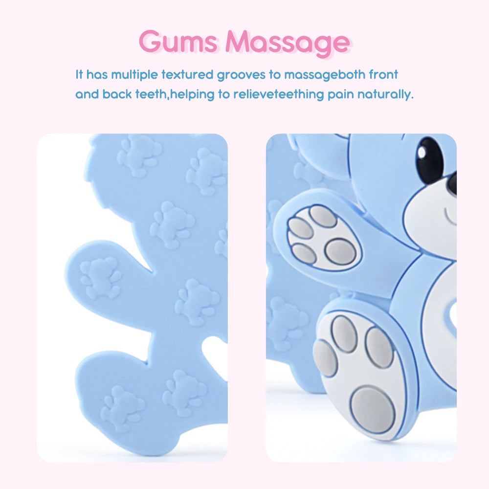 Close-up of a blue bear-shaped teething toy with textured grooves and paw print patterns, designed for gum massage and pain relief. Text above reads: "Gums Massage."