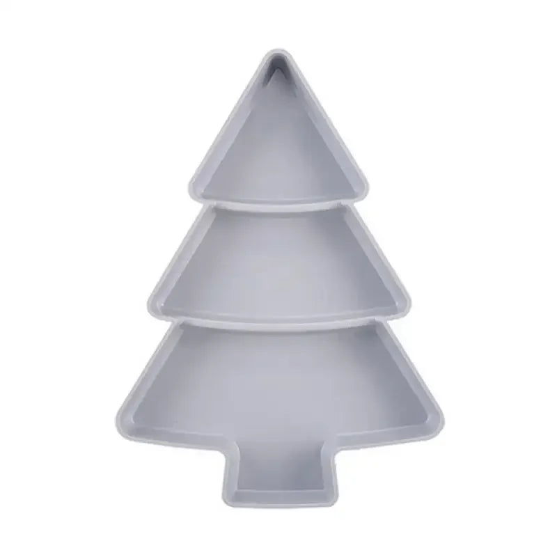 White, three-tiered serving tray shaped like a Christmas tree, featuring separate sections for organizing appetizers or snacks.