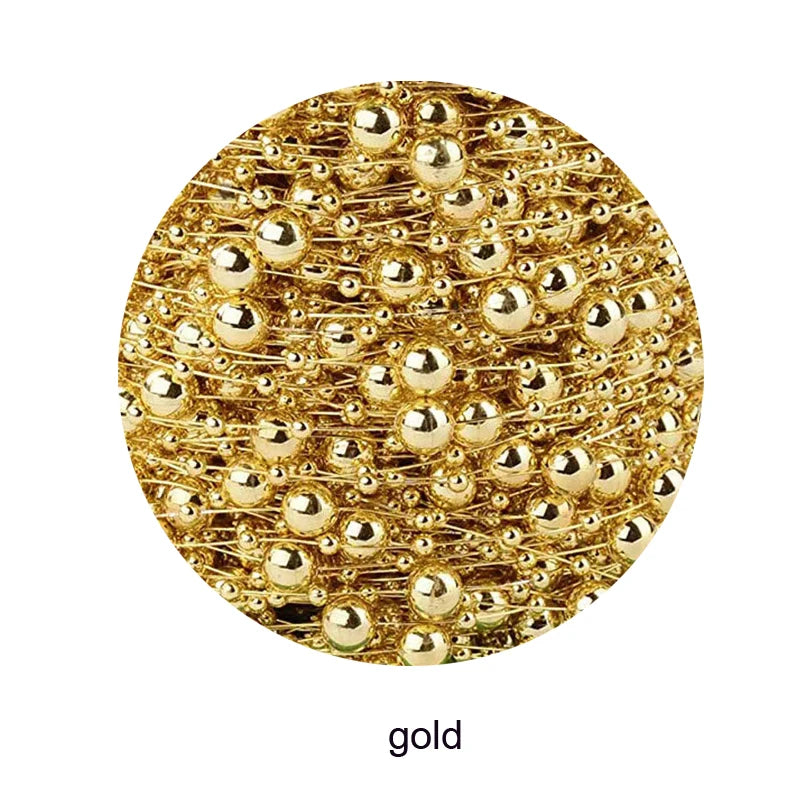 Close-up of shiny gold sphere-shaped beads tangled together, creating a glistening pattern in a circular frame. The label below reads "gold."