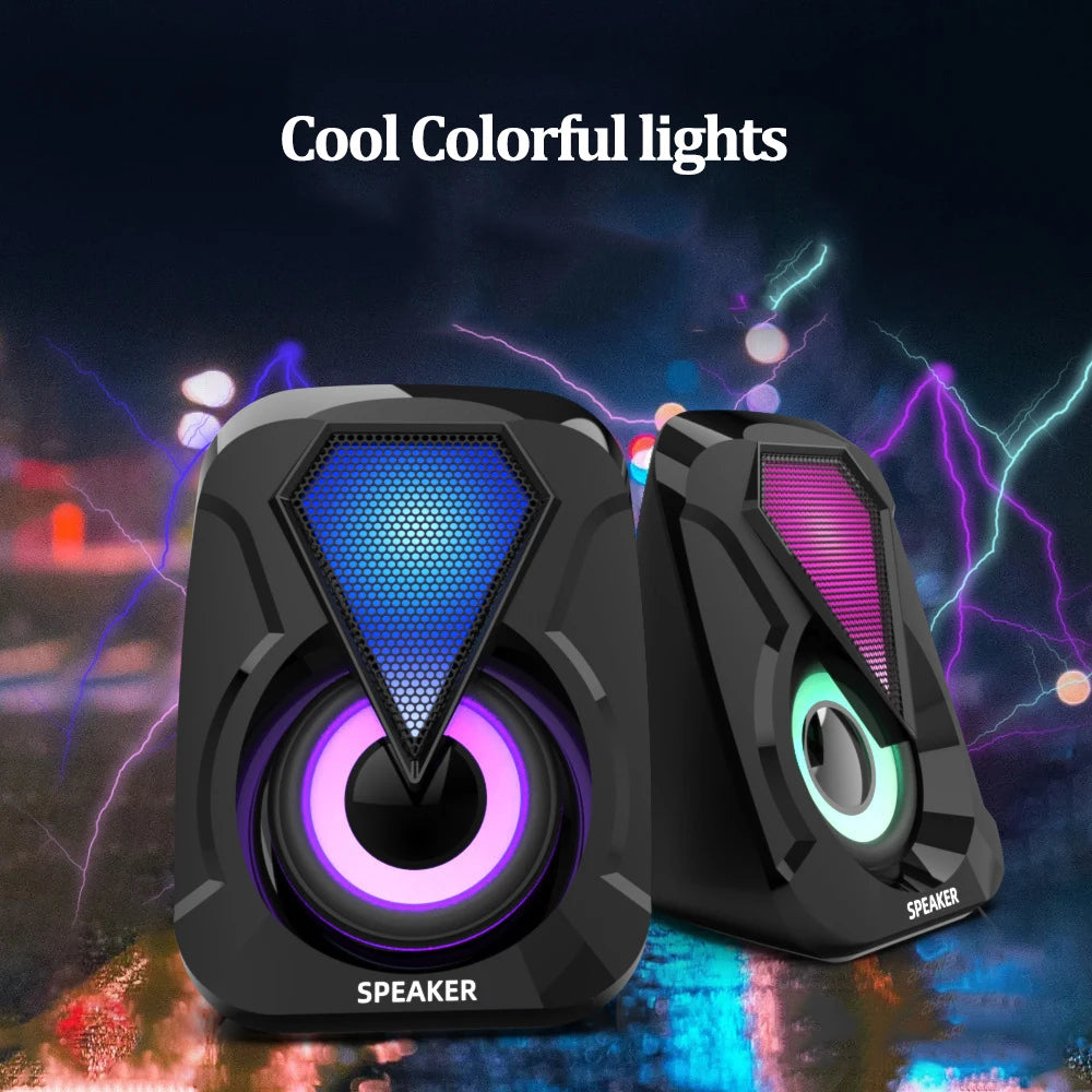 Two black speakers with colorful LED lights set against a vibrant background with electric effects and bokeh. The text "Cool Colorful lights" is displayed above.