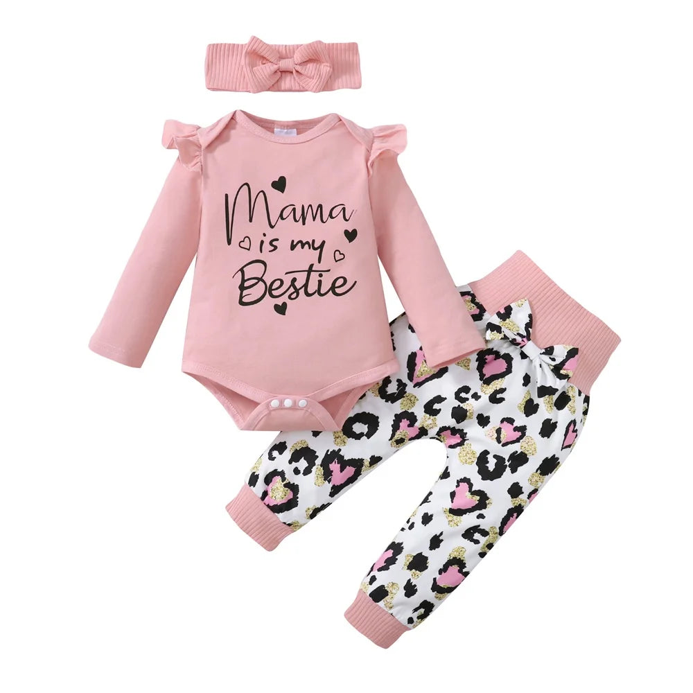 Pink baby outfit with "Mama is my Bestie" on the top, paired with leopard print pants and a matching pink headband.