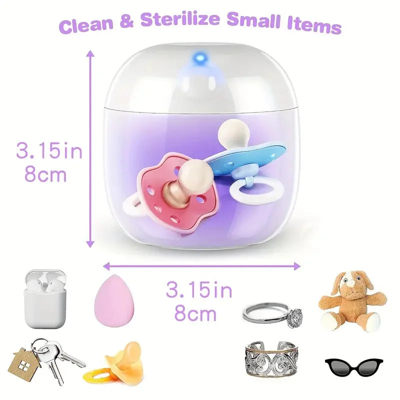 Purple and white sterilizer cube, 3.15 inches, with pacifiers inside. Surrounding items show size compatibility: AirPods, keys, sponge, ring, toy, and sunglasses.