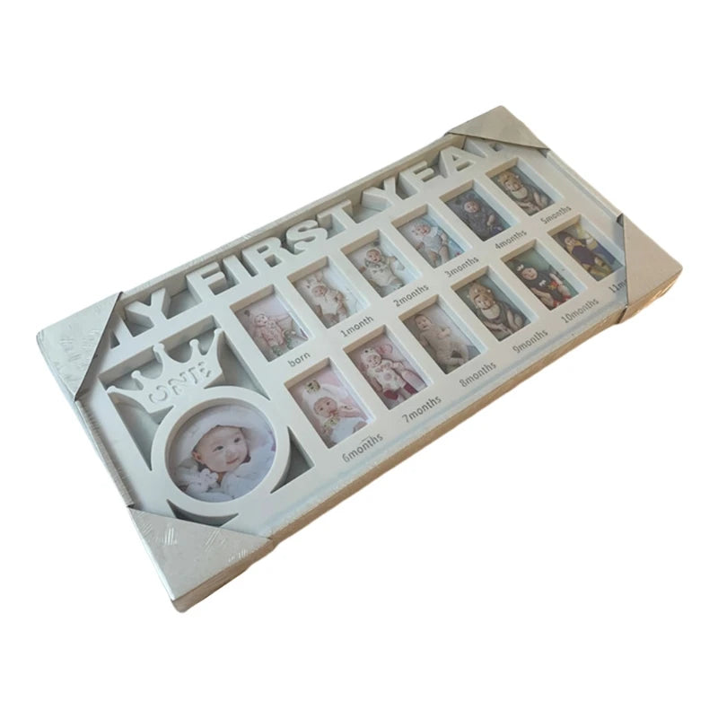 White photo frame titled "My First Year" with slots for monthly baby pictures from birth to 12 months. A crown design with "One" is above the larger central picture.