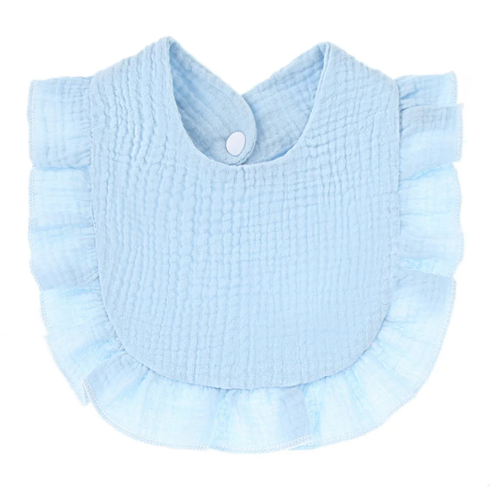 Light blue baby bib with a textured, crinkled fabric. It features a round neckline with a snap closure and soft ruffled edges, perfect for meal times.