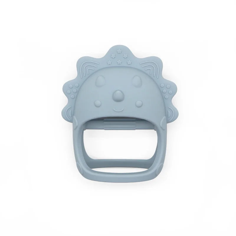 Blue baby teether shaped like a cartoon character's face, with textured edges for chewing. Made of soft material, designed for infants to soothe gums.
