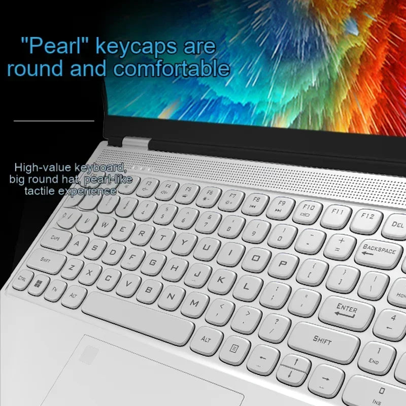 Laptop keyboard featuring round, pearl-like keycaps with a comfortable tactile feel. The screen displays a vibrant, colorful pattern, enhancing the modern aesthetic.