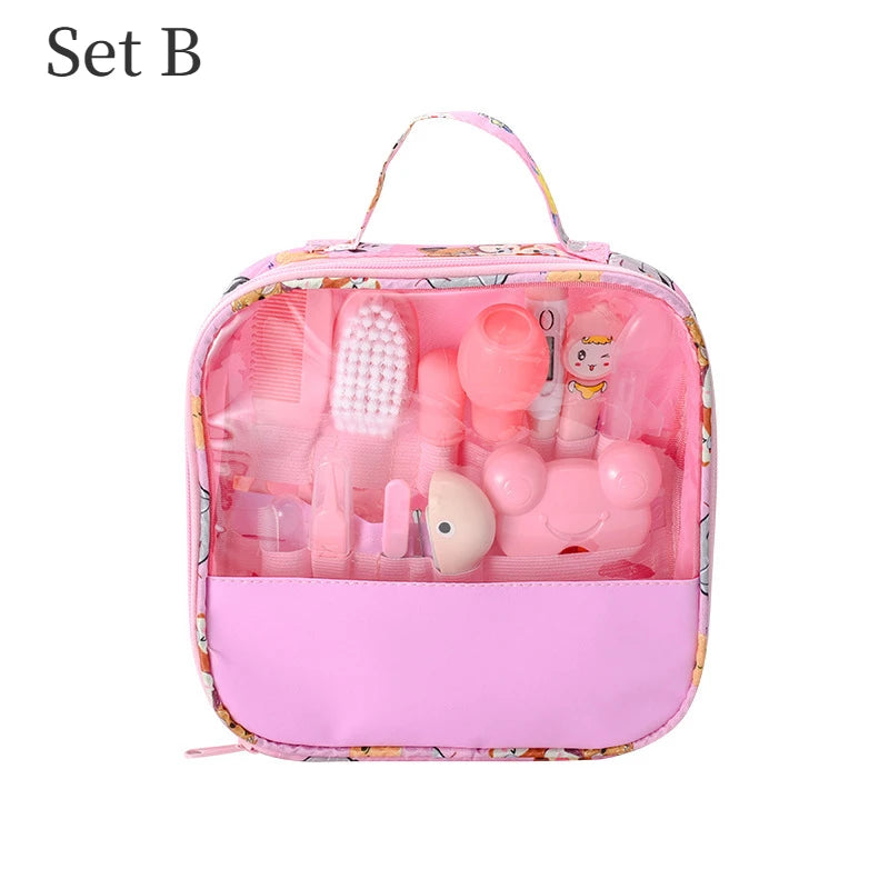A pink children's toy grooming set in a transparent zippered case with a handle. The set includes various grooming tools in pink, featuring playful designs. Labeled "Set B".