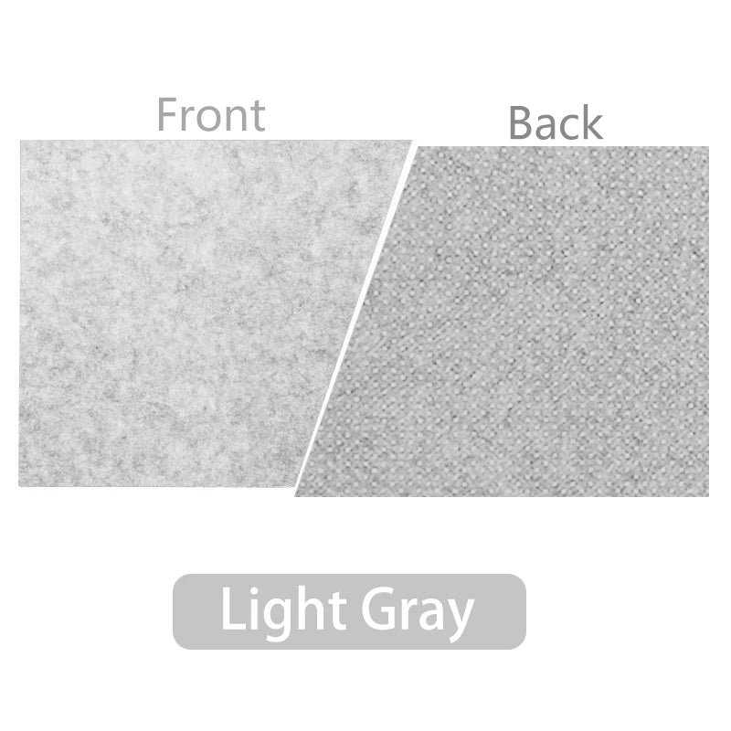 Close-up image showing the front and back textures of a light gray fabric. The front has a soft, smooth appearance, while the back is textured with a dotted pattern.