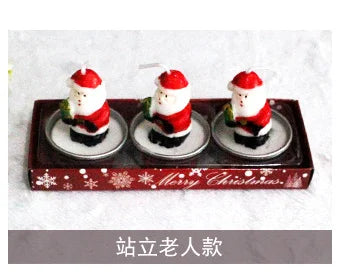 Three Santa-shaped candles in a red box with "Merry Christmas" text, set against a white background. Chinese characters below the image, possibly describing the product.