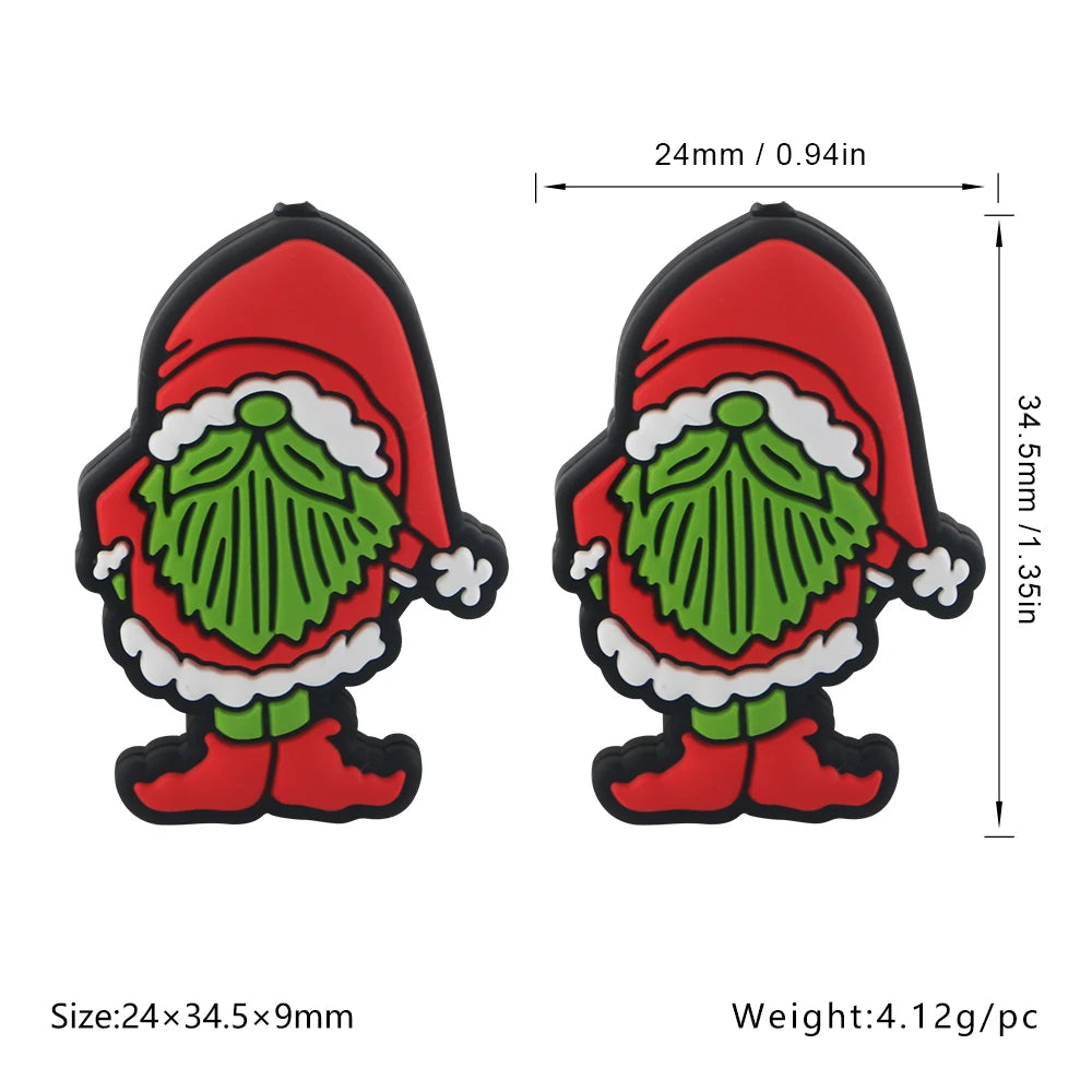 Two identical gnome figures in red Santa outfits with green beards, each measuring 34.5mm tall and 24mm wide. Size and weight details are included below.