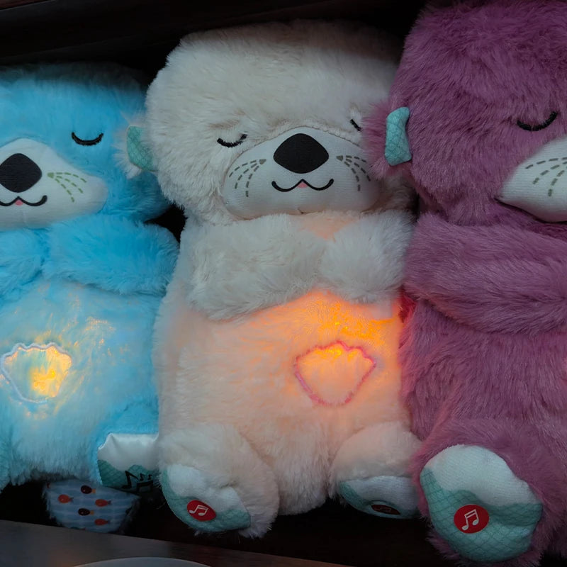 Three plush teddy bears in blue, white, and purple are in a row with eyes closed. Each bear has glowing hearts on its belly and musical notes on its feet.