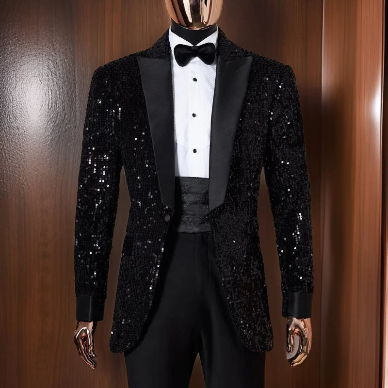 Mannequin wearing a black sequin tuxedo with satin lapels, white dress shirt, black bow tie, and cummerbund. The background features wooden paneling.