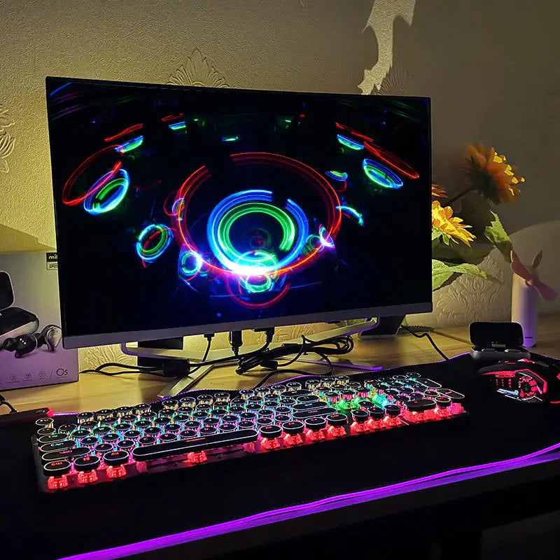 A vibrant gaming setup featuring a monitor displaying colorful neon patterns, an RGB lit keyboard, and mouse on a desk, with sunflowers in the background.