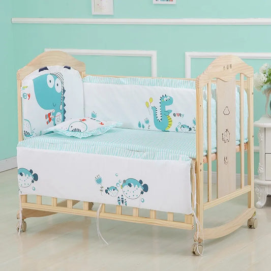 Wooden baby cot with turquoise dinosaur-themed bedding, featuring playful cartoon designs. The cot is set against a mint green wall, with light wood flooring.