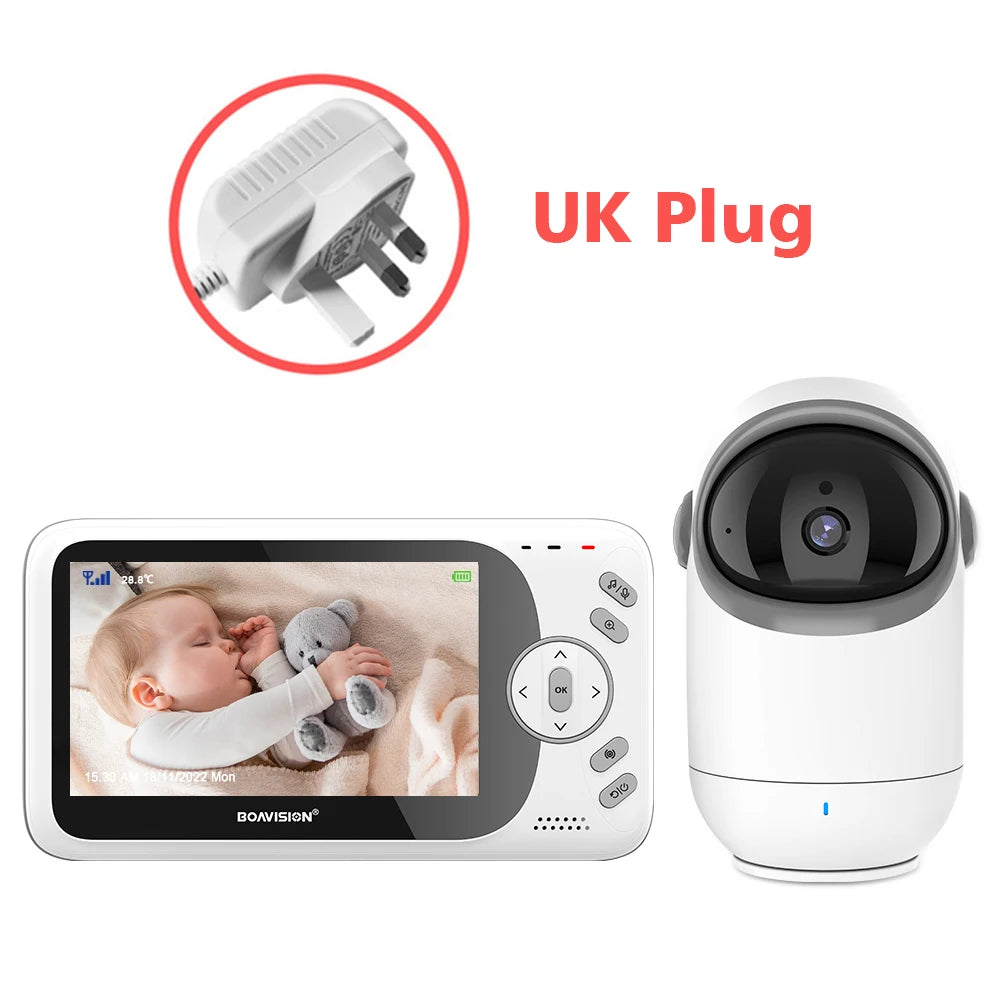 Baby monitor set with camera and screen, displaying a sleeping baby holding a stuffed toy. Includes UK plug adapter.