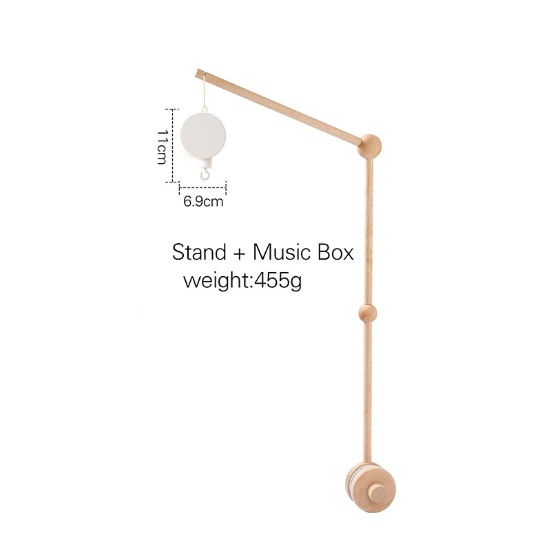 Wooden mobile arm with attached music box, measuring 11cm in height and 6.9cm in width. Text reads: "Stand + Music Box weight: 455g."