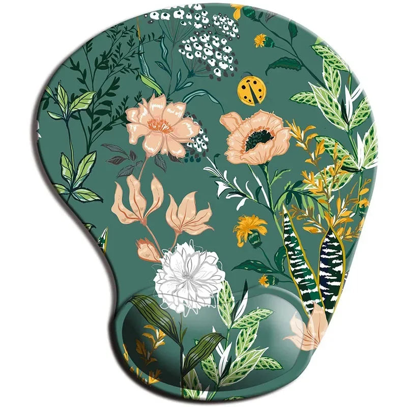 Floral mouse pad with a green background featuring colorful flowers, leaves, and a small ladybug. The design includes shades of peach, white, yellow, and various greens.