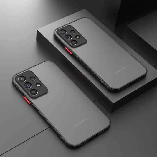 Two Samsung smartphones with sleek black designs and triple camera setups are displayed on dark geometric surfaces, highlighting red accents on their side buttons.