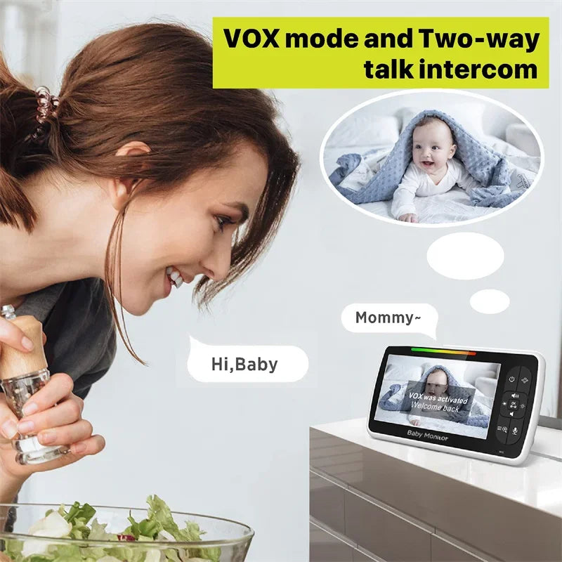 A woman smiles while leaning near a baby monitor showing a baby wrapped in a blanket. Text reads "VOX mode and Two-way talk intercom," with speech bubbles: "Hi, Baby" and "Mommy."