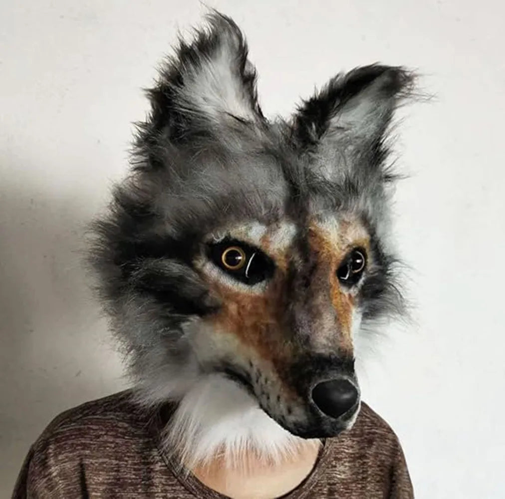 A person wearing a realistic wolf mask with detailed fur, pointed ears, and piercing eyes. The mask is predominantly gray and brown with white accents. The background is plain.