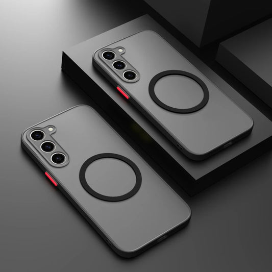 Two phones with gray cases and three camera lenses are displayed on a black surface. Each case features a black ring design and a red side button.
