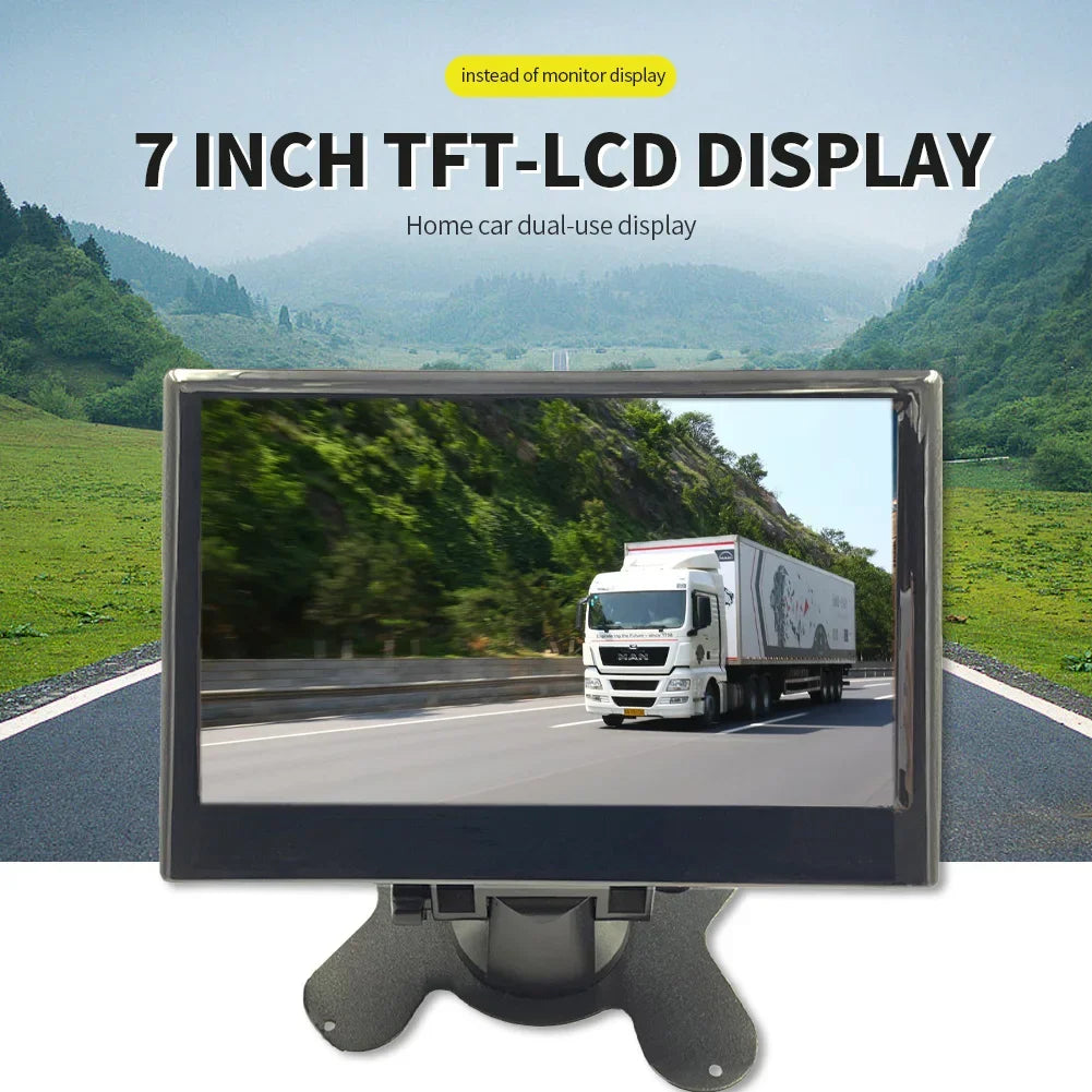 7-inch TFT-LCD display showing a truck driving on a highway with lush green hills in the background. Text above reads, "Home car dual-use display."