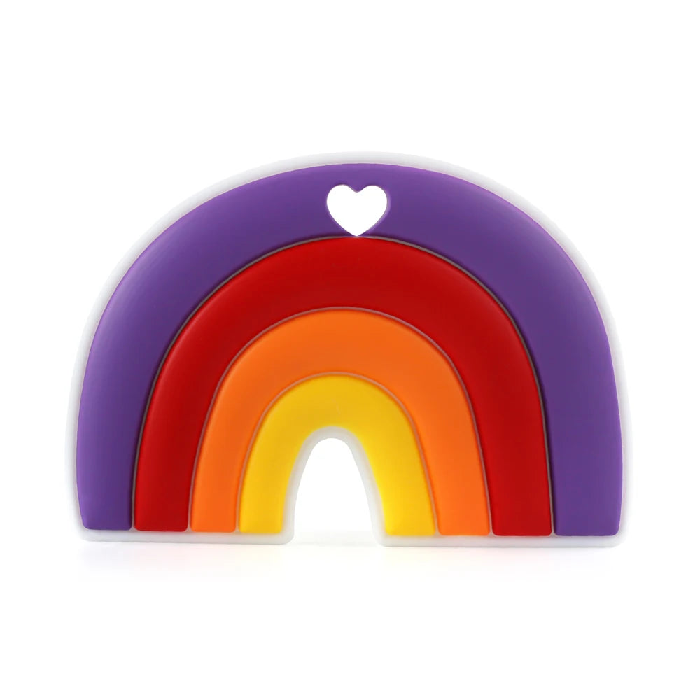 Colorful silicone teether shaped like a rainbow with purple, red, orange, and yellow arches. Features a small heart cutout at the top center.
