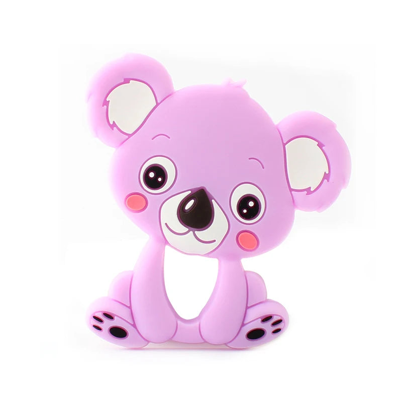 Cartoon-style pink koala with large eyes and round cheeks, sitting with ears perked up. The koala has a cutout hole in its body and a smiling expression.
