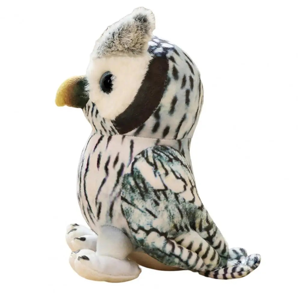Side view of a plush owl with black and white speckled patterns, fluffy ears, and a beige beak, sitting on white feet against a plain background.