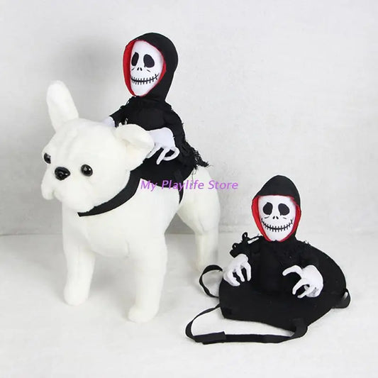 Two plush skeleton figures in black cloaks; one rides a white plush dog, while the other sits next to it. Both have white skull faces with black eyes and cheeky grins.