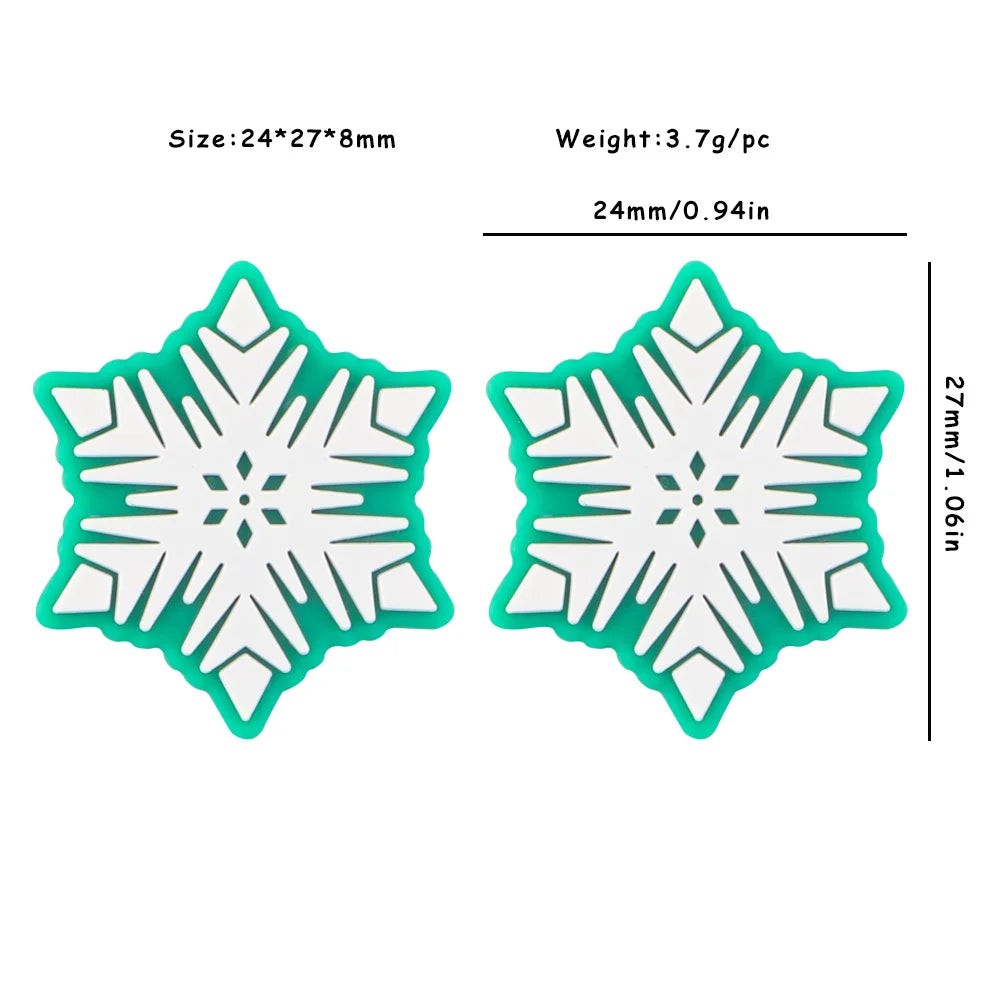 Two white snowflake-patterned objects with teal edges, measuring 24x27x8mm, weigh 3.7g each. Dimensions labeled in millimeters and inches.