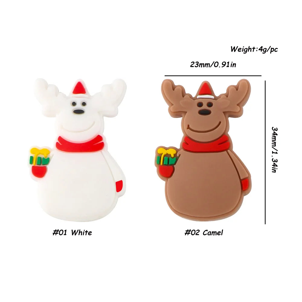 Two cartoon reindeer figures, one white and the other camel-colored, both wearing red scarves and holding gifts. Dimensions: 23mm wide, 34mm tall, weighing 4g each.