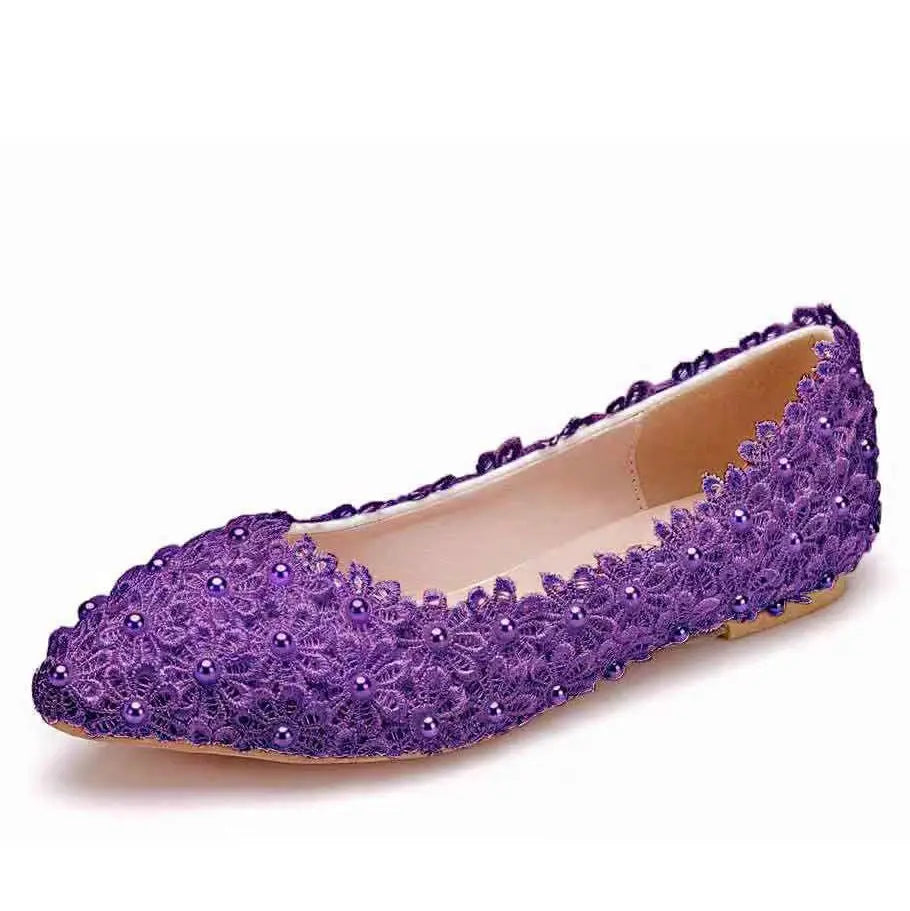 Purple lace flat shoe adorned with floral patterns and small beads, featuring a pointed toe and beige inner lining, set against a plain white background.