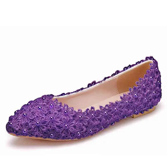 Purple lace flat shoe adorned with floral patterns and small beads, featuring a pointed toe and beige inner lining, set against a plain white background.