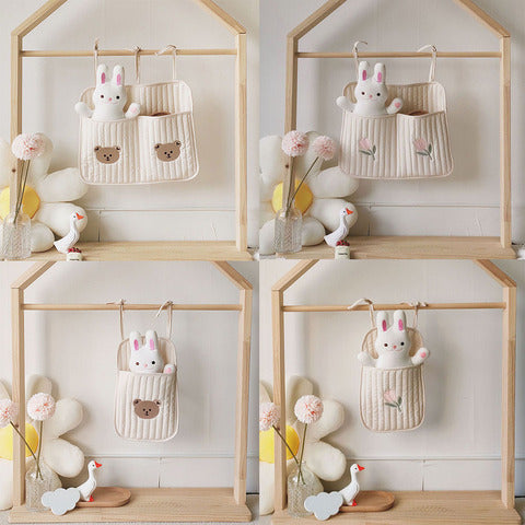 Four images show a playful storage organizer hanging on a wooden frame. Each organizer features a cute bunny design with various pocket patterns, accompanied by decorative plush toys.