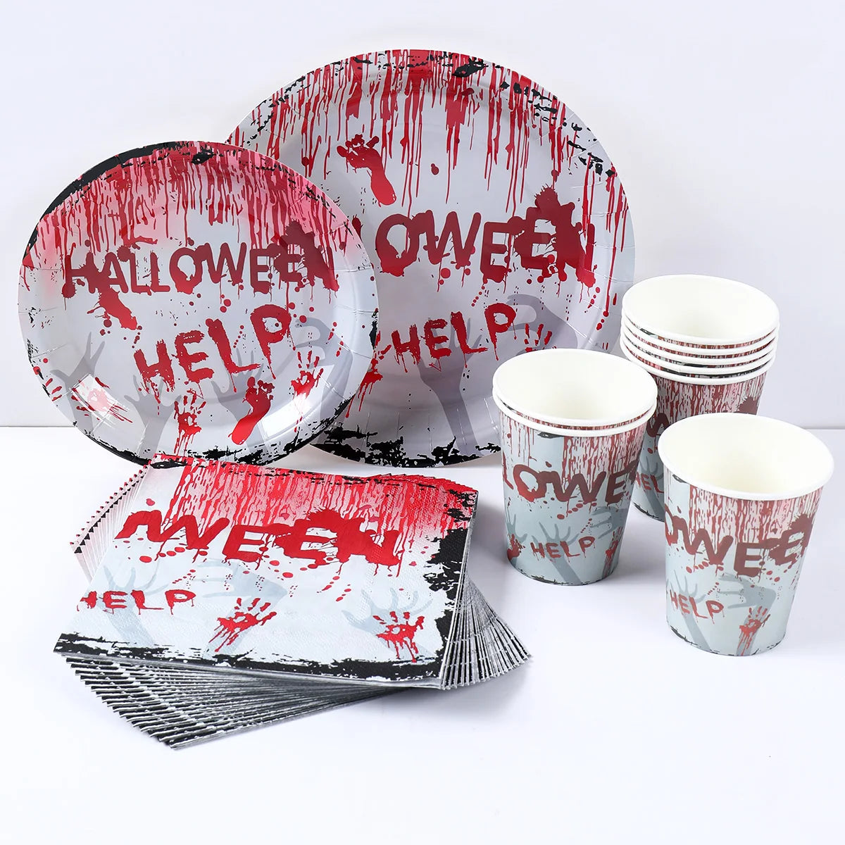 Halloween-themed partyware set featuring plates, cups, and napkins with red dripping blood design and "HELP" text. Plates are round, and cups are stacked.