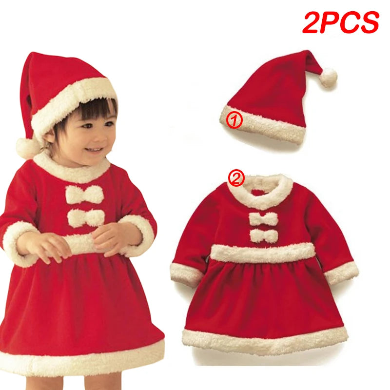 Child wearing a red Santa-themed dress and hat with white fur trim. The set, labeled as "2PCS," includes a close-up of the hat and dress displayed separately.