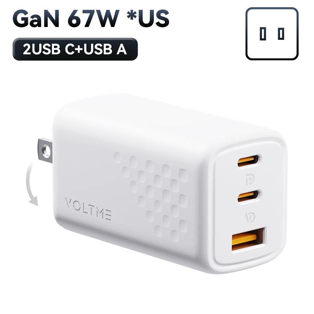White GaN 67W USB wall charger with two USB-C ports and one USB-A port. Features a foldable plug and textured pattern. Labeled with "2USB C+USB A" and "VOLTME" branding.