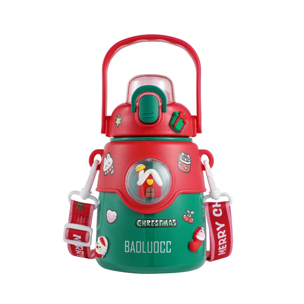 Christmas-themed water bottle in red and green with festive decorations, stickers, and a carrying strap labeled "Merry Christmas." Features a window with a cozy house design.
