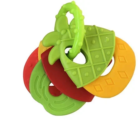 Colorful baby teething toy with four fruit-shaped plastic rings: green strawberry, red apple, orange banana, and yellow lemon. Each has a textured grip, attached to a loop.