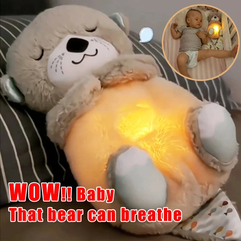 A plush toy bear with a glowing belly on a striped bed. Inset shows a baby lying beside the bear, emphasizing its comforting light. Text overlay: "WOW!! Baby That bear can breathe".