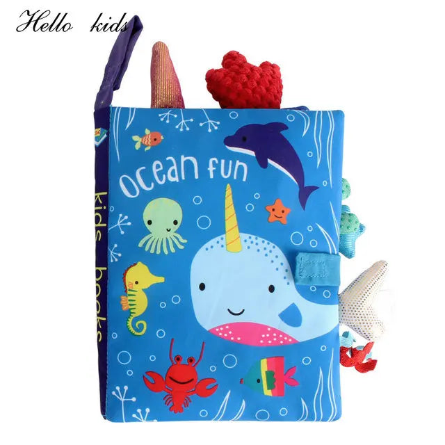 Colorful children's soft book titled "Ocean Fun" featuring a narwhal, dolphin, seahorse, octopus, crab, and other sea creatures on a blue background.