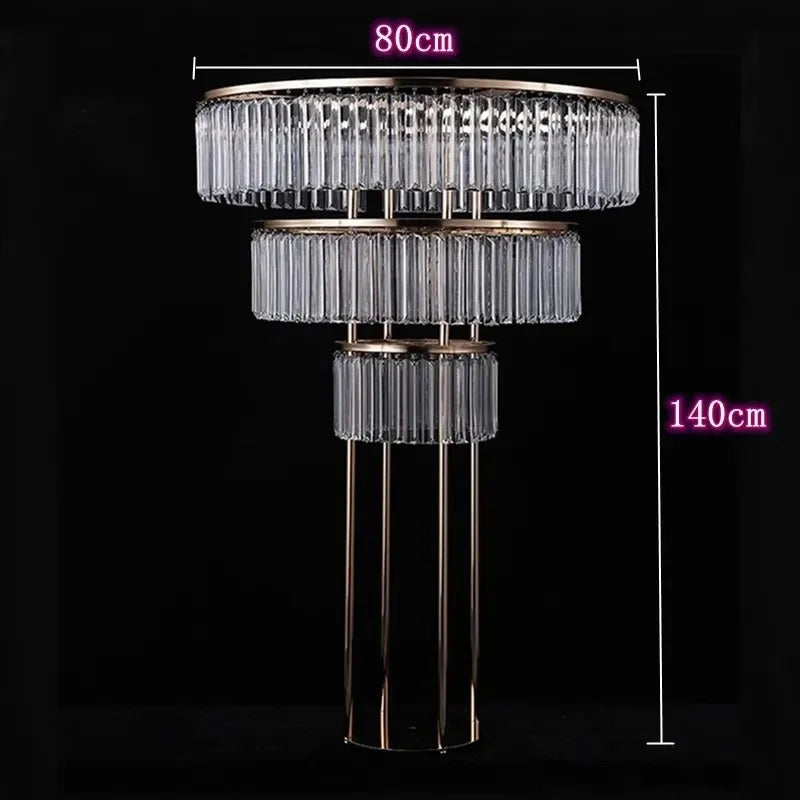 Elegant three-tiered crystal table lamp with gold frame, measuring 80cm in diameter and 140cm in height, set against a dark background.