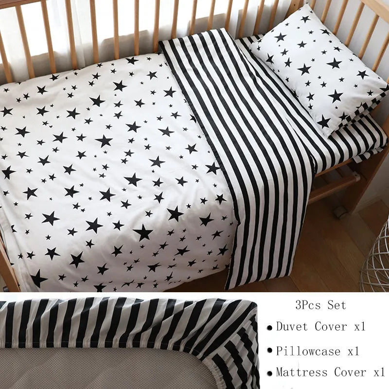 Crib bedding set with a star-patterned duvet, striped pillowcase, and matching mattress cover. The set includes one duvet cover, one pillowcase, and one mattress cover.