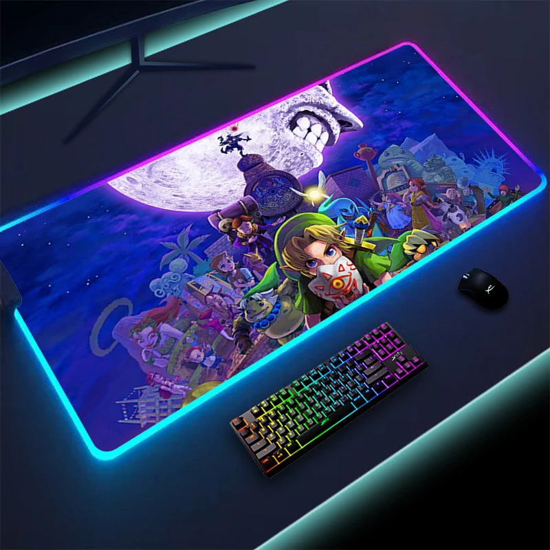 LED-lit gaming mat featuring a fantasy scene with vibrant characters and a glowing moon. A keyboard and mouse rest on a black desk with cool lighting.